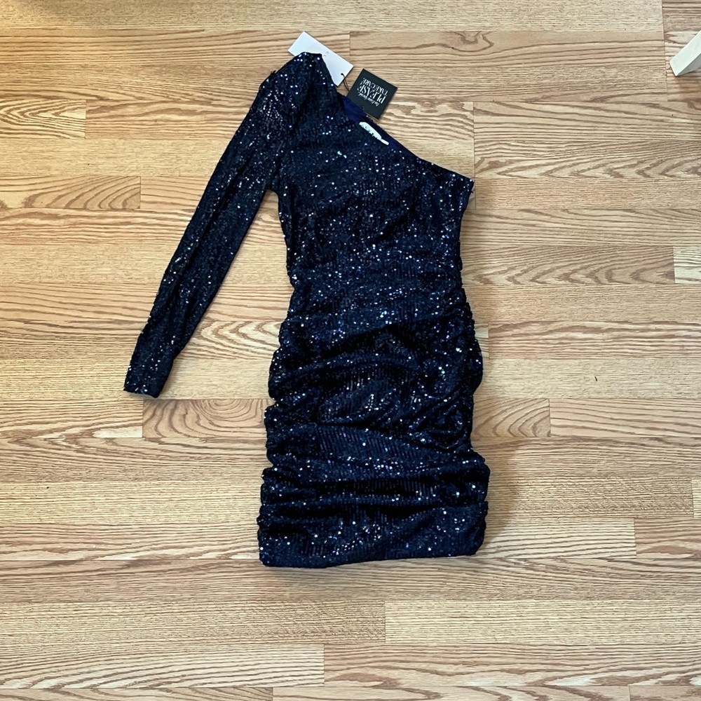Never worn semi-formal dress. One shoulder completely covered in sequins.